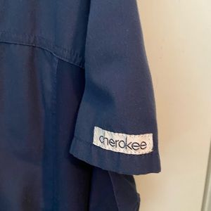 Cherokee navy blue Scrub top. Very comfortable with pockets.